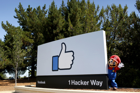 In this photo provided by Nintendo of America, Mario pays a visit to Facebook headquarters in Menlo Park on Wednesday, July 29, 2015. During a "hackathon" event, Facebook employees created their own levels for the upcoming Super Mario Maker game for Nintendo's Wii U home console. The top level, as selected by Nintendo and Facebook judges, will be made available to players for free after the game launches on the 11th of September. (Photo by Alison Yin/Invision for Nintendo/Facebook/AP Images)