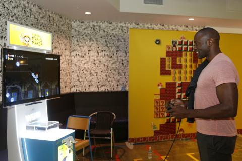 In this photo provided by Nintendo of America, Facebook Director of Strategic Product Partnerships, Ime Archibong, judges a level in the Super Mario Maker game during a special "hackathon" event hosted by Nintendo at Facebook HQ in Menlo Park on Wednesday, July 29, 2015. The winning level will be available for Super Mario Maker owners to download and play shortly after the game's launch on the 11th of September. (Photo by Alison Yin/Invision for Nintendo/Facebook/AP Images)