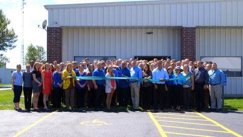 REG employees and leadership celebrated with a ribbon cutting at the company's opening of its second Ames building at 215 Alexander Avenue on July 28. (Photo: Business Wire)