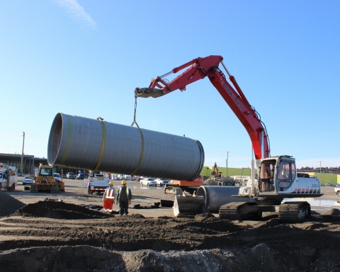 Delivered from the recently opened ADS distribution yard in Abbotsford, a 6-meter (20-foot) long section of large diameter SaniTite HP pipe is moved into place for a nearby mega-mall project. (Photo: Business Wire)
