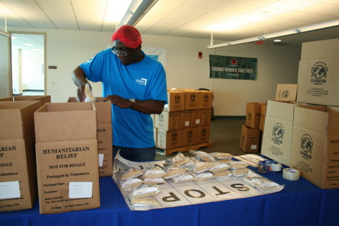 Lexington Insurance Company employee helps package 40,000 meals for Stop Hunger Now to feed the hungry. Lexington Insurance celebrated its 50th anniversary Wednesday, Aug. 12, at its Boston headquarters volunteering to assemble and package meals for Stop Hunger Now and working with other charities around Boston. (Photo: Business Wire)