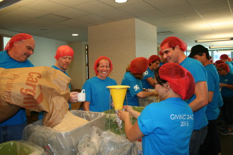 Food stations set for Lexington Insurance Company employees to assemble and package 40,000 meals for Stop Hunger Now to feed the hungry. Lexington Insurance celebrated its 50th anniversary Wednesday, Aug. 12, at its Boston headquarters volunteering for Stop Hunger Now and other charities. (Photo: Business Wire)