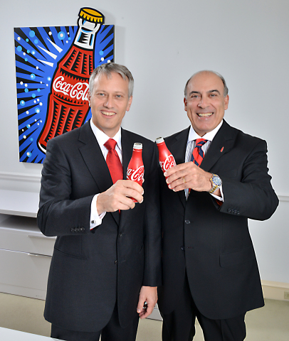 James Quincey, President and Chief Operating Officer, The Coca-Cola Company, stands with Muhtar Kent, Chairman and Chief Executive Officer, The Coca-Cola Company. Quincey, a 19-year Coca-Cola veteran, assumed responsibility for all of the Company's operating units worldwide, effective Aug. 13, 2015. (Photo: Business Wire)
