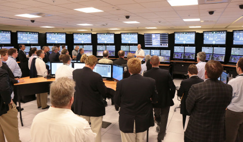 NuEx attendees tour world’s first Small Modular Reactor (SMR) Control Room Simulator located at NuScale Power’s Corvallis office. The simulator serves as a virtual nuclear power plant control room that allows NuScale to evaluate different approaches to the design and operation of a power plant using its technology. (Photo: Business Wire) 