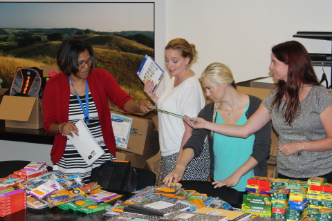 Sallie Mae employees sort thousands of school supplies the company collected and donated to the Sunday Breakfast Mission. (Photo: Business Wire)