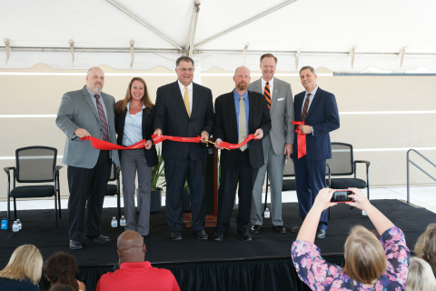 Benefitfocus, Inc. hosted a ribbon-cutting ceremony today to mark the grand opening of its office expansion in Greenville, S.C. (From left to right: David Finley, Jessica Brewer, Ray August, Greg Monn, Mayor Pro Tem David Sudduth, James Trusko) (Photo: Business Wire)