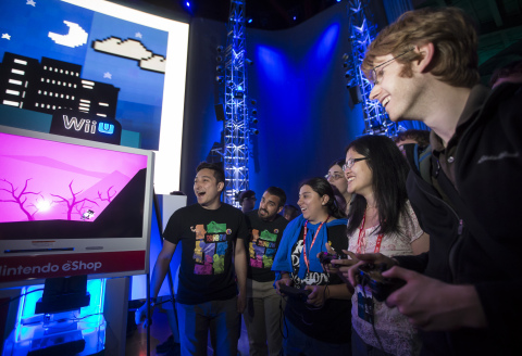 In this photo provided by Nintendo of America, attendees compete in a wild nine-player multiplayer race in Runbow by 13AM Games at Nindies@Night, a special event celebrating recently released and upcoming independent games at EMP Museum in Seattle on Aug. 27, 2015. The free event featured a presentation from “Nindie” developers, many different playable games, multiplayer competitions and giveaways.