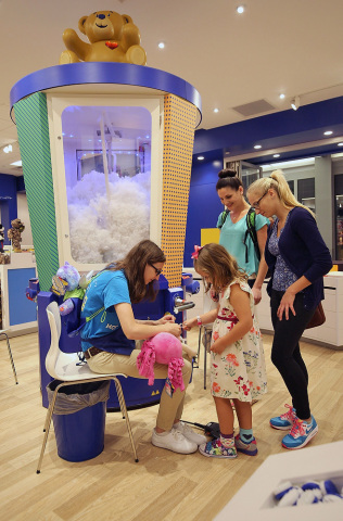 A guest creates a special furry friend at the newest Build-A-Bear Workshop at Mall of America in Bloomington, Minn., during a special grand opening ceremony today. Build-A-Bear Workshop celebrated the launch of a new look and feel for stores at today’s ceremony complete with an updated storefront, fresh new logo, and seven-foot-tall stuffer – all part of the company’s strategy to make its iconic experience even more memorable for guests. (Photo: Business Wire)