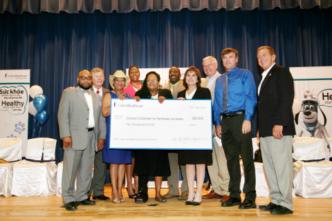 Children's Coalition for Northeast Louisiana Received a $50,000 grant from UnitedHealthcare. The donation was given during a check-presentation ceremony at Carroll High School. Guests and community leaders, including (L to R) Wossman High School Principal Sam Moore; State Sen. Francis Thompson; Monroe City Schools Board member Brenda Shelling; State Rep. Katrina Jackson; Children's Coalition for Northeast Louisiana representative Gatha Green; Carroll High School Principal Patrick Taylor; Dr. Ann Kay Logarbo, chief medical officer of UnitedHealthcare Community Plan of Louisiana; State Rep. Frank Hoffman; Monroe City Schools Superintendent Brent Vidrine; and State Sen. Mike Walsworth attended the event to see first-hand the program's impact in the community through presentations and a facility tour (Photo: Suhan Wallace).