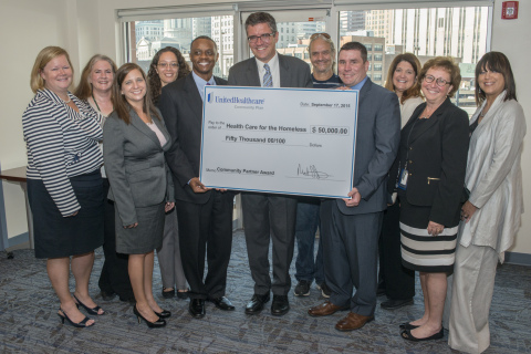 Mike Jones, CEO of UnitedHealthcare of Maryland (right), presented the $50,000 grant to Kevin Lindamood, president and CEO of Health Care for the Homeless (center) at the agency's headquarters clinic downtown. Pictured (left to right) Health Care for the Homeless Board Member Elena Marcuss, Health Care for the Homeless Senior Director of Behavioral Health Jan Caughlan, UnitedHealthcare of Maryland Chief Operating Officer Jessica Pappas, Health Care for the Homeless Chief Strategy Officer Keiren Havens, Health Care for the Homeless Board Member Michael Jackson, Health Care for the Homeless President and CEO Kevin Lindamood, Health Care for the Homeless Board Member and client advocate Mark Schumann, UnitedHealthcare of Maryland CEO Mike Jones, UnitedHealthcare of Maryland Chief Medical Officer Dr. Edith Calamia, Health Care for the Homeless Chief Financial/Operating Officer Fran Pruce and UnitedHealthcare of Maryland Marketing Director Rhonda Ricks. (Photo Credit: Craig Weiman)