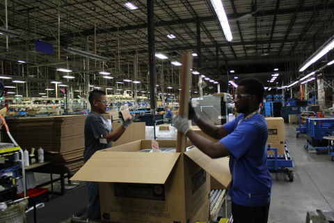 Production operators Isaias Sebastian and Jacquez Wiggins work on the line in LaFayette, Ga. (Photo: Business Wire)