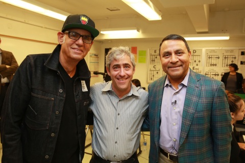 (Pictured left to right) Liberty DeVitto, a native Brooklynite and rock drummer best known for his work with Billy Joel, joined David Wish, Chief Executive Officer and Founder of Little Kids Rock and Dinesh Paliwal, Chairman, President and CEO of HARMAN, to deliver music gear and instruments directly to the students at the Juan Morel Campos secondary school. The event kicked off the companies' partnership to strengthen music education in public schools through the development of a new music technology curriculum. (Photo: Business Wire)