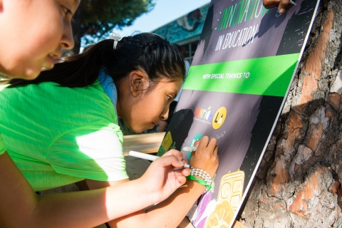 Students from the “Green Team” at West Vernon Elementary in Los Angeles write notes on a poster at the announcement of the Healthy Kids Innovation Grant program Thursday, Oct. 1. United Health Foundation and Whole Kids Foundation will provide $150,000 in the first round of grants to support innovative projects nationwide that will improve children’s health and nutrition (Photo: Rachael Thompson).