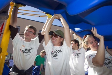 UnitedHealthcare employees lifted a slide piece into place as more than 200 UnitedHealthcare and Roxbury-area volunteers, along with New England Patriots and New England Revolution players, built a new playground at Children's Services of Roxbury. This playground build is part of UnitedHealthcare's "Do Good. Live Well." program, an employee-volunteer initiative to help prevent obesity. The volunteers worked with KaBOOM!, a national nonprofit organization dedicated to bringing play to all kids. The Children's Services of Roxbury playground is the 2,688th KaBOOM!-organized build since 1996, and the 19th created by KaBOOM! and UnitedHealthcare (Photo: UnitedHealthcare).