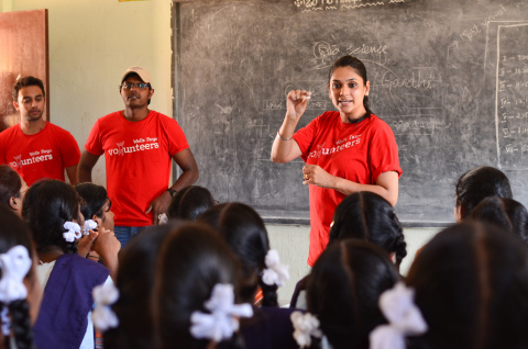 A Wells Fargo volunteer teaching students at the Kothaguda School in Hyderabad as part of the volunteering month. (Photo: Business Wire)