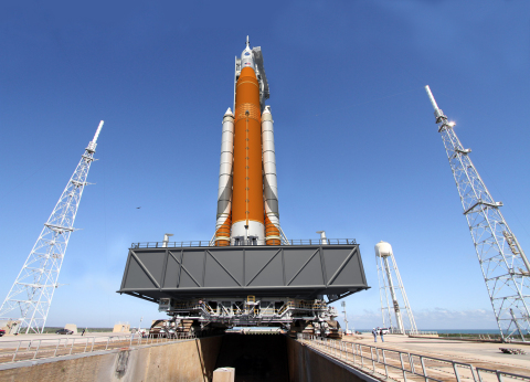 NASA’s four major prime contractors for SLS and Orion—Aerojet Rocketdyne, The Boeing Company, Lockheed Martin and Orbital ATK—have completed a number of accomplishments that bring America one step closer to deep space. This artist’s rendering depicts the SLS rocket on its way to the launch pad. Image credit: NASA
