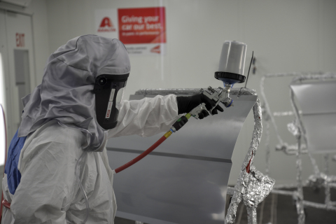 Axalta guest sprays paint in new booth at Axalta’s Houston Refinish and Powder Coatings Learning and ... 