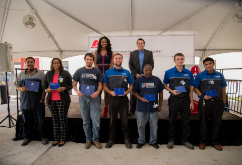 Universal Technical Institute students receive Axalta Collision Repair Scholarships and Grants: Front row left to right: Universal Technical Institute students Angel Quinones, Jasmine Storey, Robert Rioux, Blair Platt, Jerald Miller, Tyler Codr and Victor Fuentes. Back row left to right: Axalta’s Lisa Miree-Luke and Jeff Blake (Photo: Axalta)