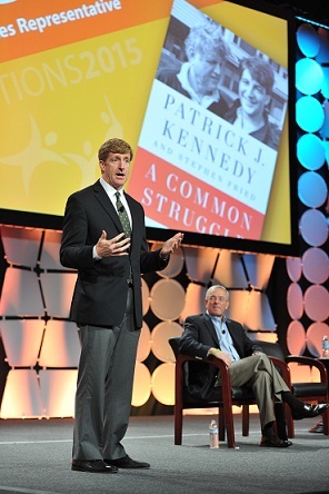 Mental health advocate Patrick J. Kennedy addresses CONNECTIONS2015 audience as Netsmart Executive Vice President Kevin Scalia looks on. (Photo: Business Wire)