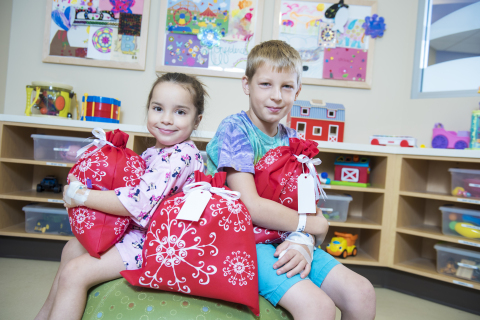 The Container Store today announces its new, community giving program, Holiday Hugs. The retailer is partnering with children's hospitals across the country to collect and deliver new, unwrapped gifts to young patients who are spending the holidays away from home. (Photo: Business Wire)