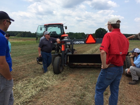 Kevin Cobb, Senior Product Training Manager for Kubota, discusses hay equipment and harvest techniques with University of Georgia, Athens, county extension agents. (Photo: Business Wire)