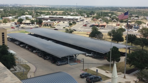 Parking canopies composed of SolarWorld solar panels stand as part of a new solar system at the West Texas VA Health Center in Big Spring. (Photo: Business Wire)