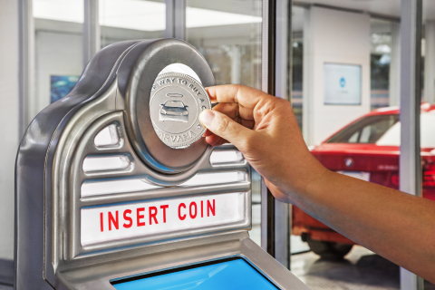 Insert a Carvana-branded coin into the Vending Machine slot and watch it come to life, delivering your car from the Tower to you in seconds. (Photo: Business Wire)