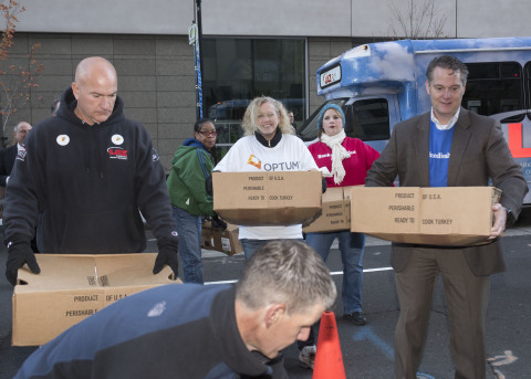 A LAZ Parking volunteer (left) unloaded turkeys donated by the company with UnitedHealthcare, Optum and Bank of America volunteers. More than 1,200 families in Hartford and Tolland counties will be able to sit down to Thanksgiving dinner thanks to the generosity of Hartford employers and residents who stopped by 185 Asylum St. to drop off turkeys and other holiday food items, and donate money for additional meals. The food will be distributed to families in Hartford and Tolland counties who requested assistance in preparing their holiday meals. Foodshare will continue to collect and distribute food for Thanksgiving until Tuesday, Nov. 24. For more information on how to help, or for a list of food donation sites, visit www.aturkeyand30.org (PHOTO: Alan Grant, Digital Creations).