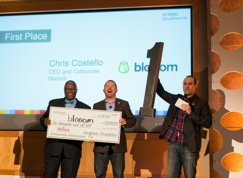 Kansas City’s Mayor Sly James (left) presents the top prize to Chris Costello, CEO of Leawood-based startup blooom (middle), who was named “One in a Million” in the Ewing Marion Kauffman Foundation’s startup competition today. (Photo: Business Wire)
