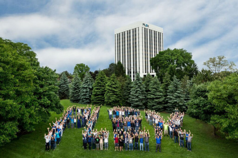 Plex employees in front of the company’s Troy, Michigan, headquarters, a Top Workplace according to the Detroit Free Press (Photo: Business Wire)