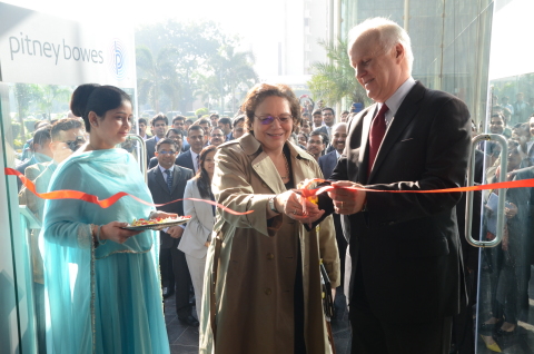 Executive Administrator Abeer Khan assists with the ribbon cutting as Chief Human Resources Officer Johnna Torsone and CEO Marc Lautenbach officially open the new Pitney Bowes office in Gurgaon, India. (Photo: Business Wire)