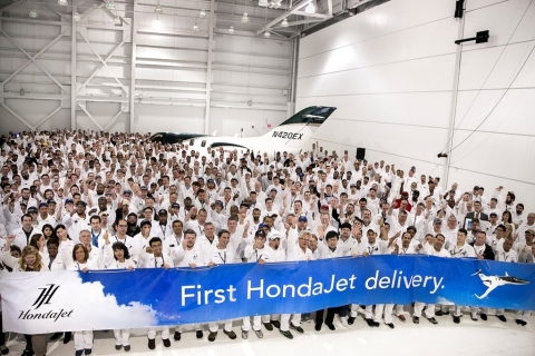 Honda Aircraft Company associates celebrate the first HondaJet delivery. (Photo: Business Wire)
