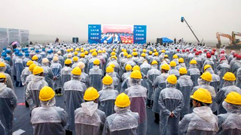 Workers Watch Ground-Breaking Ceremony for first-ever Six Flags-branded theme park in China. (Photo: Business Wire)