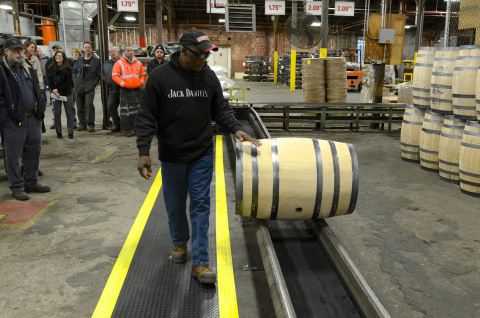 Charlie Harden, longest Brown-Forman Cooperage employee, conducts ceremonial barrel roll during the Anniversary celebration. (Photo: Business Wire)