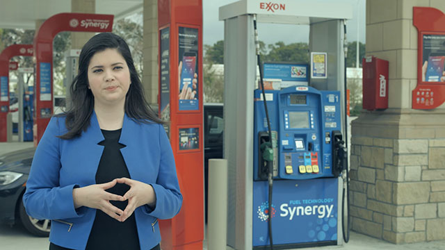 B-Roll footage: interview with Krissy Rud, Program Advisor, Mobile Payment and Loyalty - ExxonMobil Fuels, Lubricants and Specialties Marketing, Retail Fuels Company; Establishing shots and signage; female app use in car; female app use outside and fueling; and male app use outside.