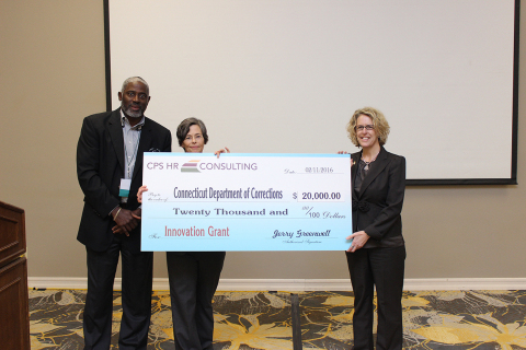 Jerry Greenwell and Teresa Webster from CPS HR Consulting award Cheryl Cepelak, deputy commissioner - administrative division of Connecticut's Department of Correction, the $20,000 Innovation Grant at CPS HR's first annual client conference. (Photo: Business Wire)