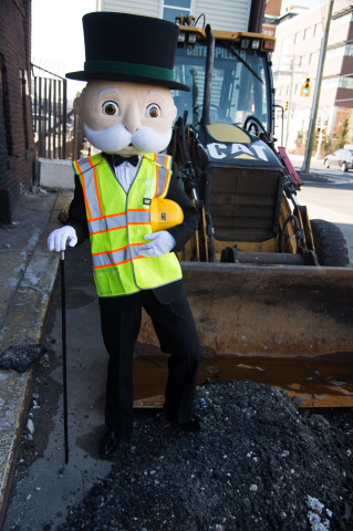 MR. MONOPOLY gears up with Cat construction and prepares to build his empire in celebration of the MONOPOLY EMPIRE game and World MONOPOLY Day on March 19, 2016. (Photo: Business Wire)