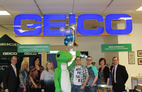 GEICO rolled out the red carpet for its 14 millionth policyholder Christopher Stevens (pictured next to the Gecko) at a GEICO field representative office in Chattanooga, Tenn. To celebrate the milestone purchase, the company provided a limo for Stevens, live music, gift cards, and items from the GEICO Store. Pictured from left to right are Rhett Rayburn, GEICO regional vice president; GEICO agents Stephanie Piotrowski, Connor Hall, Ashley Newberry; The GEICO Gecko; Christopher Stevens; Guest Joshua Morris; Greta Vaughn, GEICO field representative; and John Little, GEICO assistant vice president. (Photo: Business Wire)