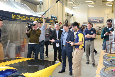 Jeff Gordon speaks with U-M student Shihaab Punia about the Solar Car while visiting the University of Michigan campus to help unveil a new partnership between U-M and Axalta Coating Systems. (Photo: Axalta)
