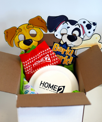 Every Home2 Suites property will offer National Pet Day parties on April 11 that will include gifts like bandanas and Frisbees to encourage guests and pets to attend (Photo: Business Wire)