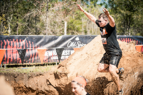 A Tough Mudder participant challenges the Old Spice Mud Mile 2.0 during the April 9, 2016 Tough Mudder event in Milton, Florida. (Photo: Business Wire)
