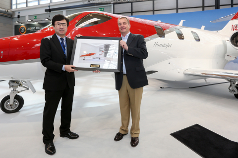 Honda Aircraft Company President and CEO Michimasa Fujino participates in a ceremonial delivery with Johannes Graf von Schaesberg, chairman and CEO of Rheinland Air Service. 
(Photo: Business Wire)