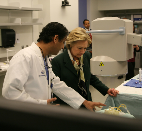 Hillary Clinton examining vascular model produced on a Stratasys Objet500 Connex3 3D Printer with Dr. Adnan H. Siddiqui, Chief Medical Officer, The Jacobs Institute (Photo: Jacobs Institute)