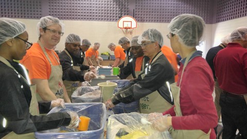Axalta Canada employees pack meals for kids in need. (Photo: Axalta)