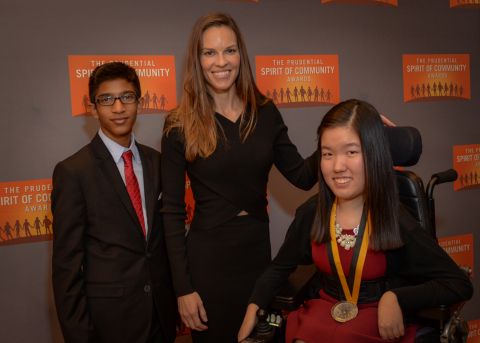 Academy Award-winning actress Hilary Swank congratulates Jungin Angie Lee, 17, of Naperville (right) and Nicolas Ramkumar, 14, of Champaign (left) on being named Illinois's top two youth volunteers for 2016 by The Prudential Spirit of Community Awards. Jungin Angie and Nicolas were honored at a ceremony on Sunday, May 1 at the Smithsonian's National Museum of Natural History, where they each received a $1,000 award. (Photo: Zach Harrison Photography)