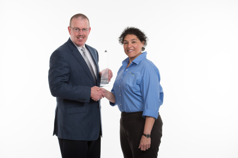 City of Greenwood Village, CO: John Jackson, Chief of Police, receives awards from Nellie De Los Santos, Product Manager, Tyler Technologies (Photo: Business Wire)