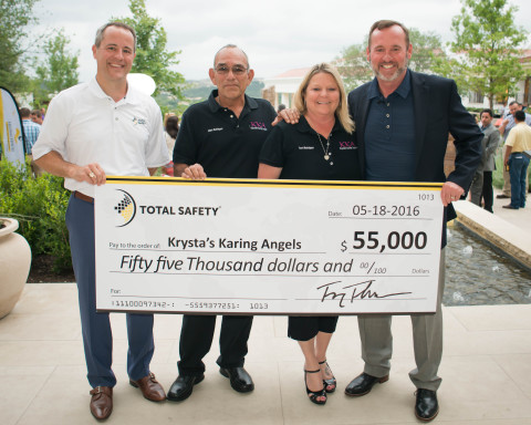 Total Safety CEO Troy Thacker and COO Paul Tyree present a $55,000 check to Krysta's Karing Angels, one of the three beneficiaries of the 2016 Helping HEROES Charity Golf Tournament. (Photo: Business Wire)