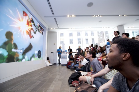 In this photo provided by Nintendo of America, Nintendo fan, Joseph Osei, gathers at the Nintendo NY store in New York on June 14, 2016, to watch Nintendo Treehouse: Live, which was live-streamed from the E3 video game trade show in Los Angeles. During the live stream, Nintendo announced The Legend of Zelda: Breath of the Wild and highlighted the immense, living and breathing open-air adventure where challenge and surprise await at every turn.