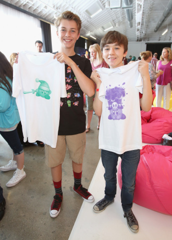 In this photo provided by Nintendo of America, kids show their custom Kirby t-shirts at the Kirby: Planet Robobot celebration at Smashbox Studios in Culver City, California, on June 22, 2016. In the new sci-fi adventure game, available now for the Nintendo 3DS family of systems, Kirby has the power to save his world from enemies with his mechanized Robobot Armor.