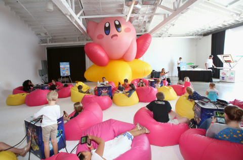 In this photo provided by Nintendo of America, kids play the Kirby: Planet Robobot game for the Nintendo 3DS family of systems at Smashbox Studios in Culver City, California, on June 22, 2016. Kirby: Planet Robobot, the new sci-fi adventure game that features the iconic character in mechanized Robobot Armor and allows players to scan amiibo to give Kirby special abilities, is now available.